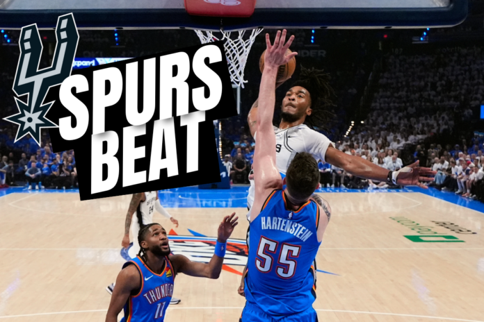 San Antonio Spurs guard Stephon Castle (5) dunks against Oklahoma City Thunder center Isaiah Hartenstein (55) during the first half of Game 2 in the Western Conference finals NBA basketball playoffs series Wednesday, May 20, 2026, in Oklahoma City. (AP Photo/Nate Billings)
