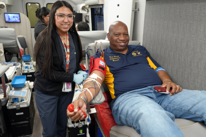 Third Division Vice Commander Burrell Parmer donated blood during a joint blood drive hosted by American Legion Posts 592 and 828 and Theta Eta Chapter of Chi Eta Phi Sorority, Inc. (Photo by Tesha Parmer, Auxiliary Unit 828)