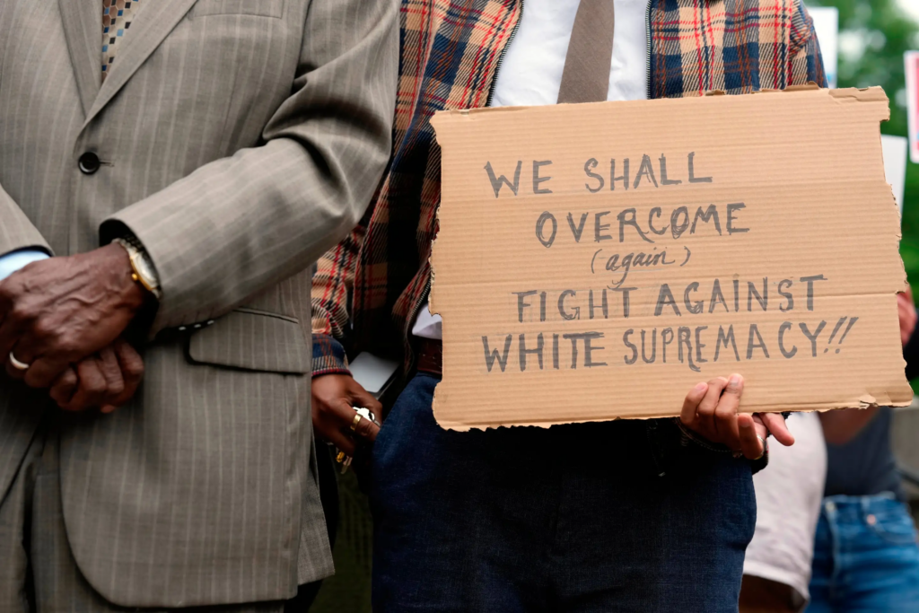 A person holds a sign during news conference before a special session of the state legislature to redraw U.S.
Congressional voting maps Tuesday, May 5, 2026, in Nashville, Tenn. (AP Photo/George Walker IV)
