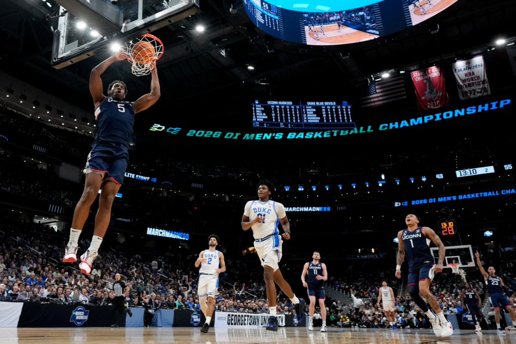 UConn forward Tarris Reed Jr. (5) dunks against Duke during the second half in the Elite Eight of the NCAA college basketball tournament on March 29, 2026, in Washington. (AP Photo/Stephanie Scarbrough, File)