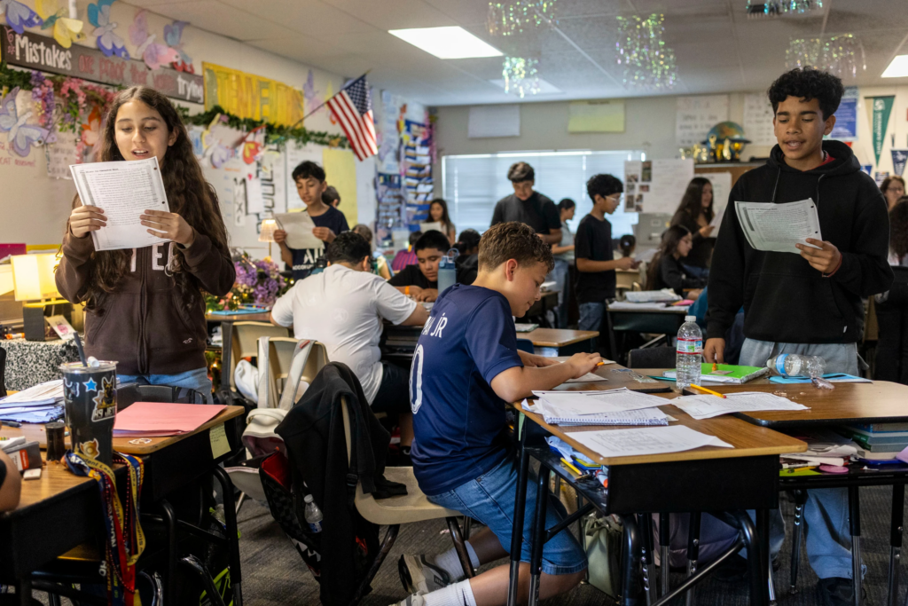 Sixth graders read a passage and give constructive feedback to their partners during Nancy Barajas class at Fairview Elementary School on Wednesday, May 6, 2026, in Modesto, Calif. (AP Photo/Annie Barker)