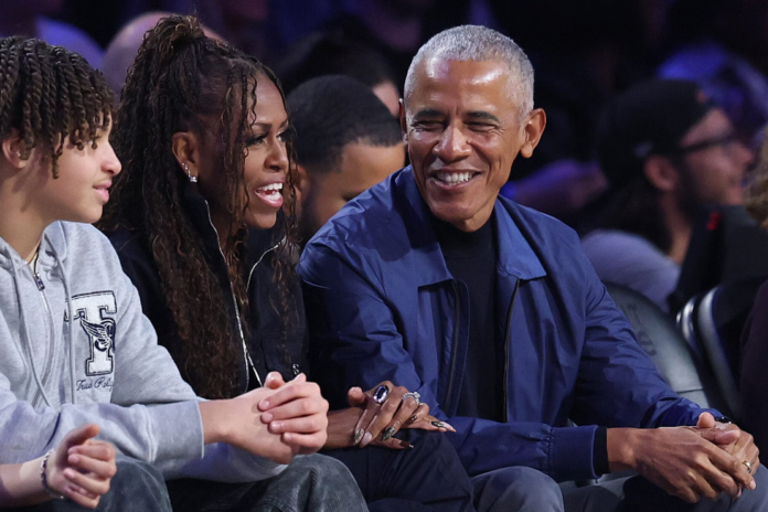 Michelle Obama and Barack Obama attend the 75th NBA All-Star Game at Intuit Dome on February 15, 2026 in Inglewood, California. NOTE TO USER: User expressly acknowledges and agrees that, by downloading and or using this photograph, User is consenting to the terms and conditions of the Getty Images License Agreement. (Photo by Ronald Martinez/Getty Images)