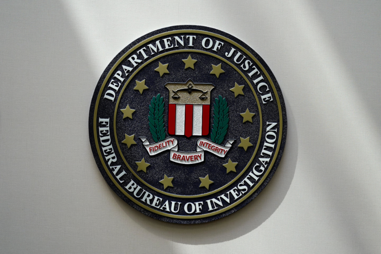 An FBI seal is seen on a wall on Aug. 10, 2022, in Omaha, Neb. Violent crime in the U.S. dropped again in 2023, according to FBI statistics that show a continued trend downward after a coronavirus pandemic-era crime spike. The report released Monday shows overall violent crime ticked down an estimated 3% in 2023 from the year before, according to the FBI. (Photo by Charlie Neibergall, AP, File)