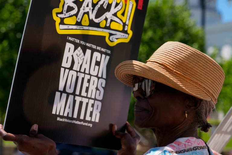 Brenda Cummings, of Montgomery, Ala., protests outside the state house during a special session of the Alabama Legislature, Monday, May 4, 2026, in Montgomery, Ala. (AP Photo/Mike Stewart)