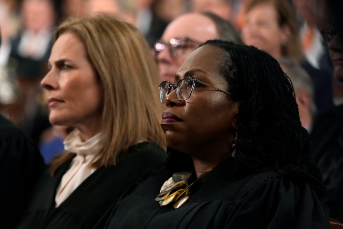 Supreme Court Justices Amy Coney Barrett and Ketanji Brown Jackson listen as President Joe Biden delivers the State of the Union address to a joint session of Congress on February 7, 2023 in the House Chamber of the U.S. Capitol in Washington, DC. The speech marks President Biden's first address to the new Republican-controlled House. (Photo by Jacquelyn Martin-Pool/Getty Images)
