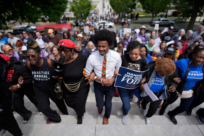 Protesters yell outside the chamber during a special session of the state legislature to redlaw US. Congressional voting maps, in Nashville, Tenn, Tuesday, May 5, 2026. (AP Photo/George Walker IN)