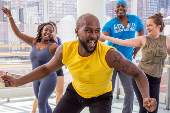Dancer O'Shae Sibley, center, participates in an Ailey Extension dance class, in New York. Whitney Browne for Ailey Extension