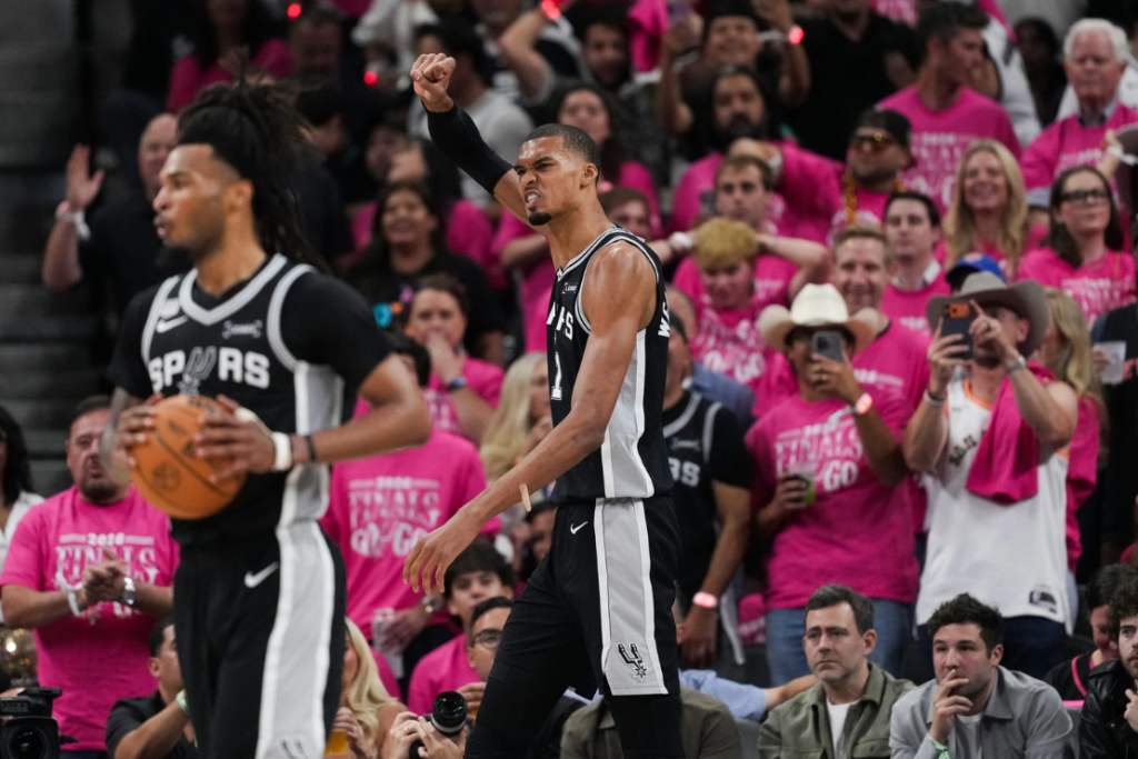 San Antonio Spurs forward Victor Wembanyama (1) celebrates a basket against the New York Knicks during the second half of Game 1 of the NBA Finals basketball series, Wednesday, June 3, 2026, in San Antonio. (AP Photo/Eric Gay)