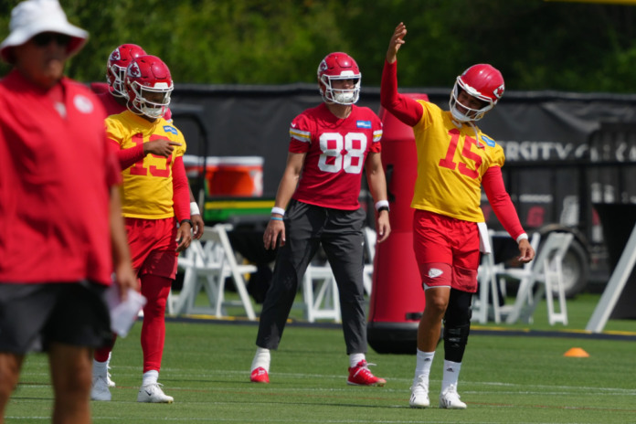 Kansas City Chiefs quarterback Patrick Mahomes (15) signals teammates during the NFL football team's practice Wednesday, June 10, 2026, in Kansas City, Mo. (AP Photo/Ed Zurga)
