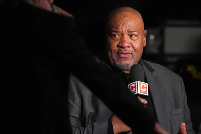 Chicago Bulls television announcer Stacey King attends the first half of an NBA basketball game, Nov. 17, 2025, in Denver. (AP Photo/David Zalubowski, File)