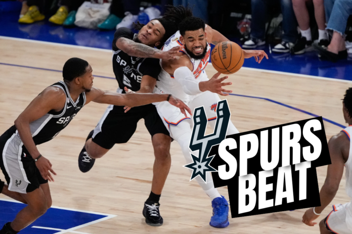 New York Knicks center Karl-Anthony Towns, right, and San Antonio Spurs guard Stephon Castle (5) battle for the ball during the second half of Game 4 of the NBA Finals basketball series, Wednesday, June 10, 2026, in New York. (AP Photo/Ross D. Franklin)