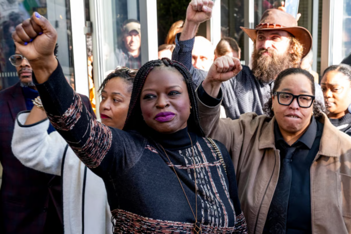 Civil rights attorney and activist Nekima Levy Armstrong (C) leaves with a group of co-defendants after an arraignment hearing at the Warren E. Burger Federal Building and U.S. Courthouse on February 13, 2026 in St. Paul, Minnesota. Levy Armstrong pleaded not guilty to charges of conspiring to violate someone’s constitutional rights and violating the FACE Act. (Photo by Stephen Maturen/Getty Images)