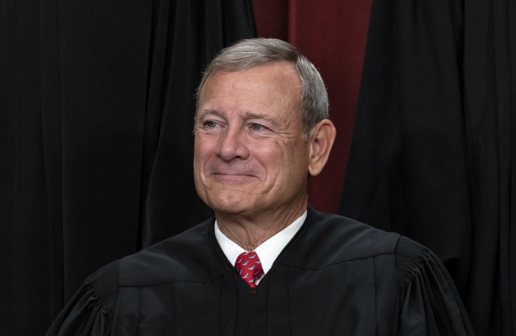 Chief Justice of the United States John Roberts joins other members of the Supreme Court as they pose for a new group portrait, at the Supreme Court building in Washington, Friday, Oct. 7, 2022. (AP Photo/J. Scott Applewhite)