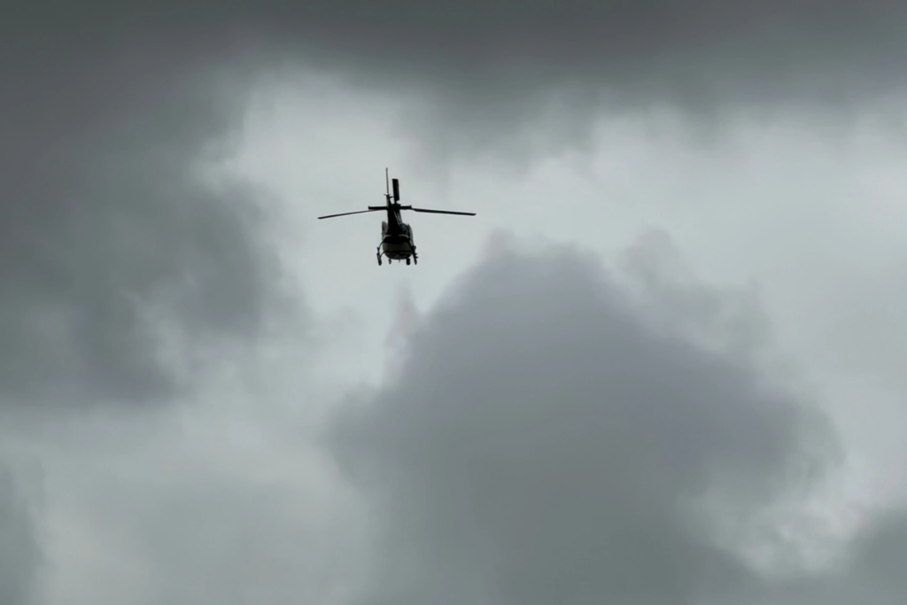 A helicopter flys over an active shooting scene Friday, June 12, 2026, in Midland, Texas. (Luke Dias/Reporter-Telegram via AP)