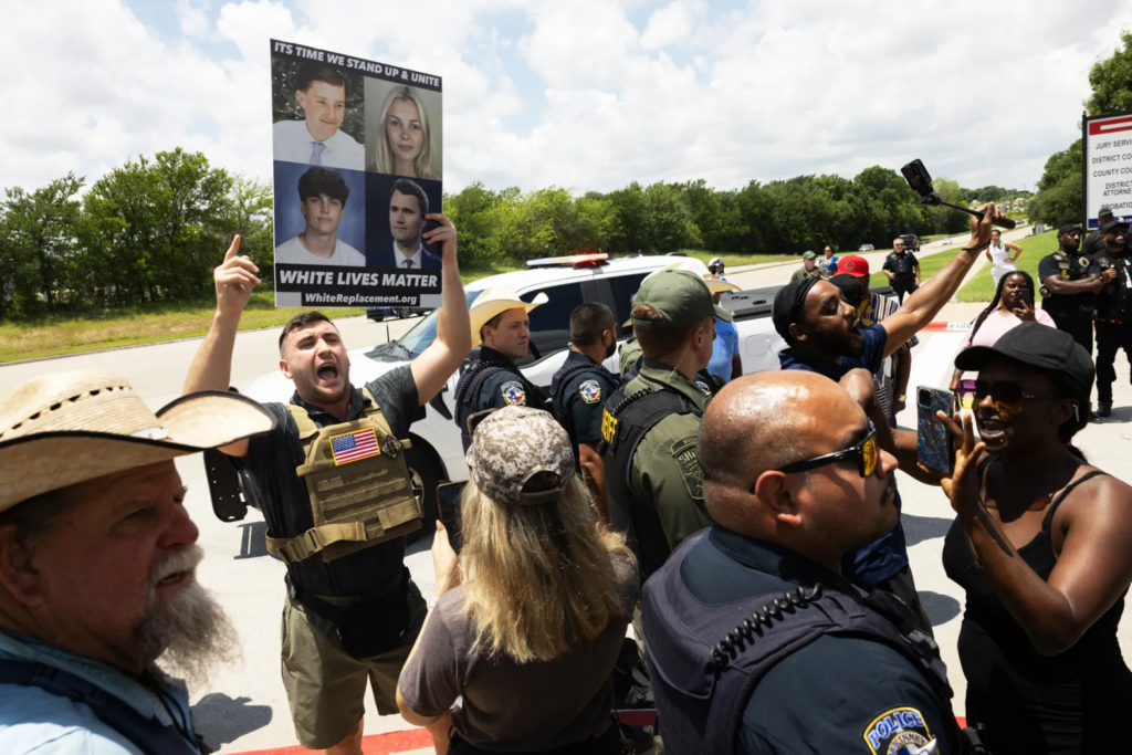 Pardoned U.S. Capitol rioter Jake Lang holding a sign during a protest outside the courthouse during Karmelo Anthony's trial.
Juan Figueroa/The Dallas Morning News/Getty Images
