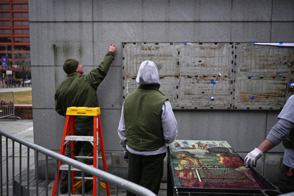 Panels that were part of an exhibit on slavery at the President's House Site in Philadelphia are put back Thursday, Feb. 19, 2026. (AP Photo/Joe Lamberti, File)