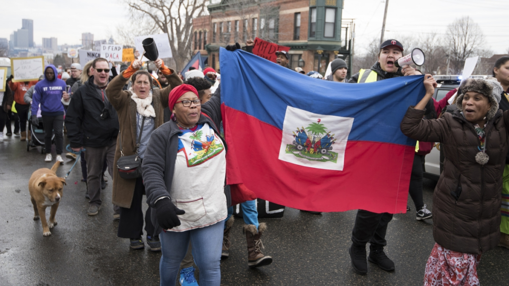 Haitian immigrants protesting Trump immigration policies i