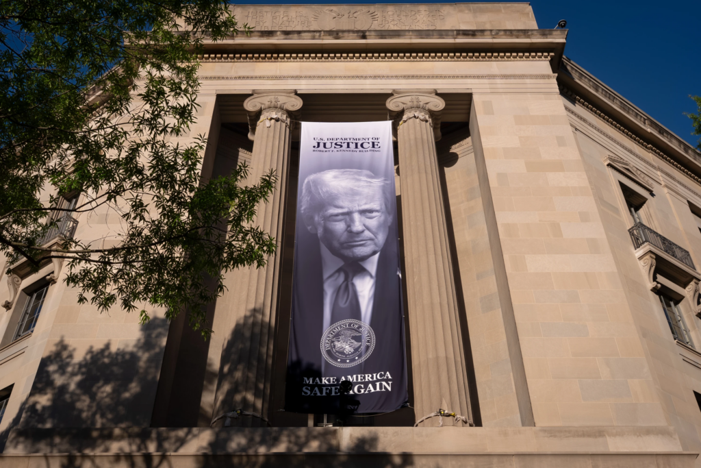A giant portrait of President Donald Trump looks down from the Justice Department in Washington, June 2, 2026. (AP Photo/J. Scott Applewhite, File)