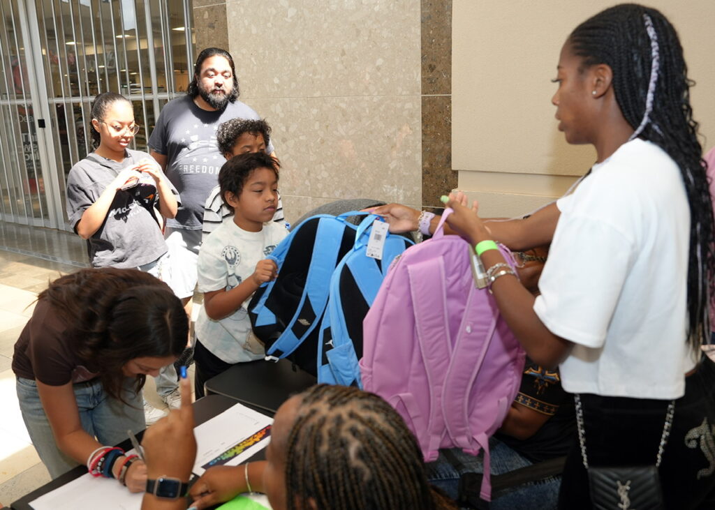 WORLD LOLEI Inc., San Antonio Rising Stars Inc. and community sponsors provided backpacks and shoes to 200 children at North Star Mall on July 19, 2026. (Photo by Executive Director Burrell Parmer/WORLD LOLEI)