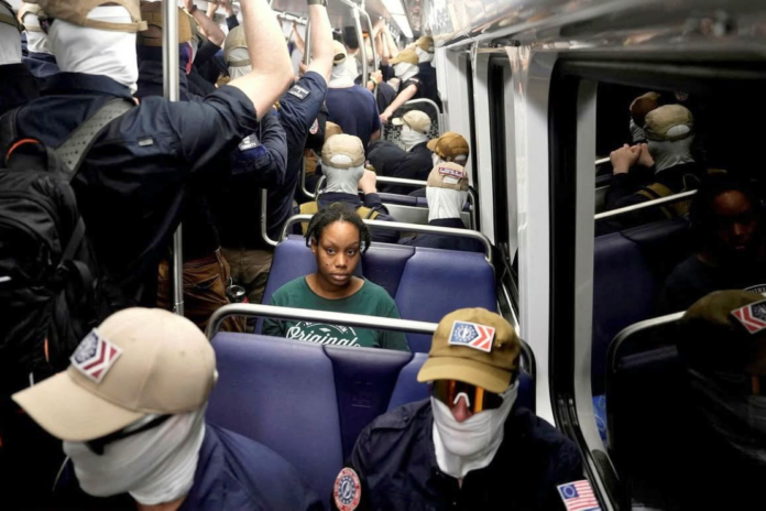 Members of the white supremacist group Patriot Front crowded into the Metro in Washington DC on Saturday following a rally. Photograph: Cheney Orr/Reuters