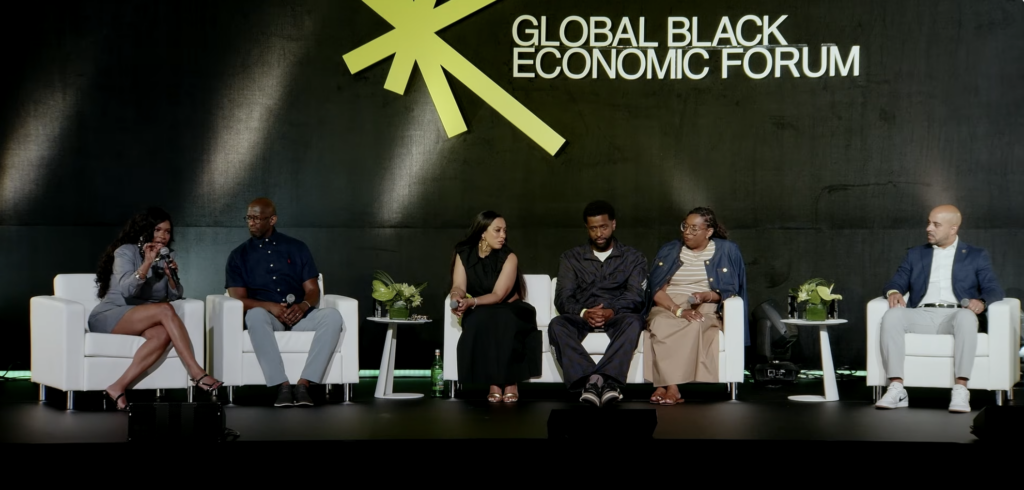 Rep. Jasmine Crockett, left, speaks during a live Native Land Pod conversation at the 2026 ESSENCE Festival of Culture in New Orleans. (Screenshot/Native Land Pod)