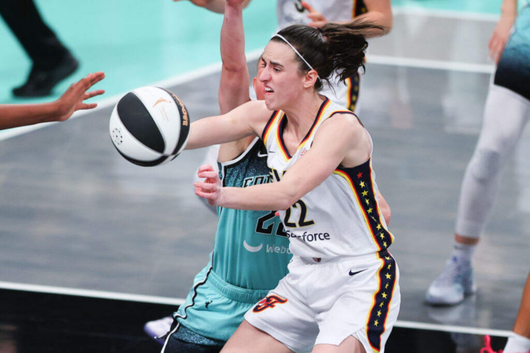 Caitlin Clark #22 of the Indiana Fever passes for the ball against the New York Liberty during the game on June 2, 2024 at the Barclays Center in Brooklyn, New York. (Rich Graessle/Icon Sportswire via Getty Images)