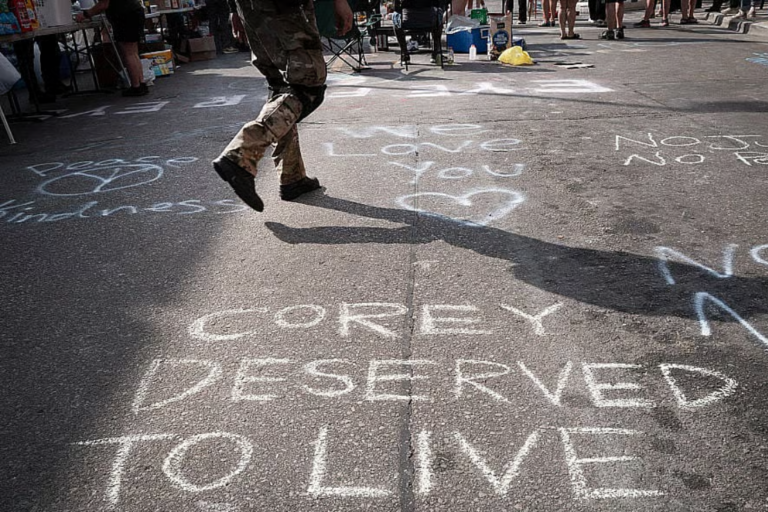 People attend a vigil at the intersection where Corey Ruiz was shot and killed yesterday by a Madison Police officer on July 23, 2026 in Madison, Wisconsin. Ruiz was killed following a brief altercation with police during which police reported he brandished a knife. (Photo by Scott Olson/Getty Images)Credit: Photo Scott Olson / Getty Images