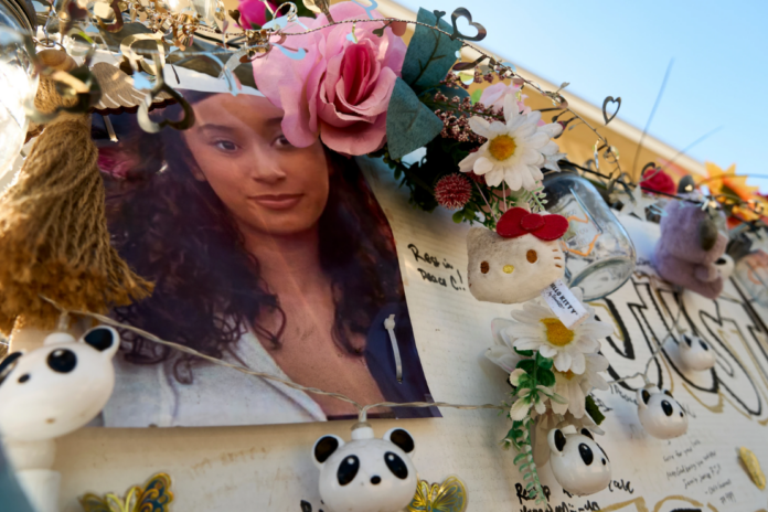 A makeshift memorial for Celeste Rivas Hernandez, whose body was found inside a vehicle owned by singer D4vd, is displayed outside her home in Lake Elsinore, Calif., on April 21, 2026. (AP Photo/Damian Dovarganes, File)