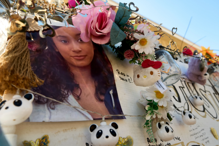 A makeshift memorial for Celeste Rivas Hernandez, whose body was found inside a vehicle owned by singer D4vd, is displayed outside her home in Lake Elsinore, Calif., on April 21, 2026. (AP Photo/Damian Dovarganes, File)