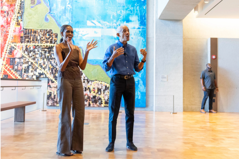 Former President Barack Obama and former first lady Michelle Obama welcome community members in the Hope and Change lobby before they walk through the museum at the Obama Presidential Center in Chicago on Friday, June 19, 2026. (Eileen T. Meslar/Chicago Tribune via AP, Pool)