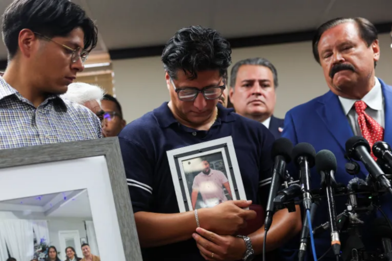 Family members hold pictures of Lorenzo Salgado Araujo, who was fatally shot by a US Immigration and Customs Enforcement (ICE) agent in Houston, Texas, the United States [Antranik Tavitian/Reuters]