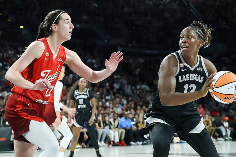 Chelsea Gray and Caitlin Clark during the game on July 12. David Becker/NBAE via Getty
