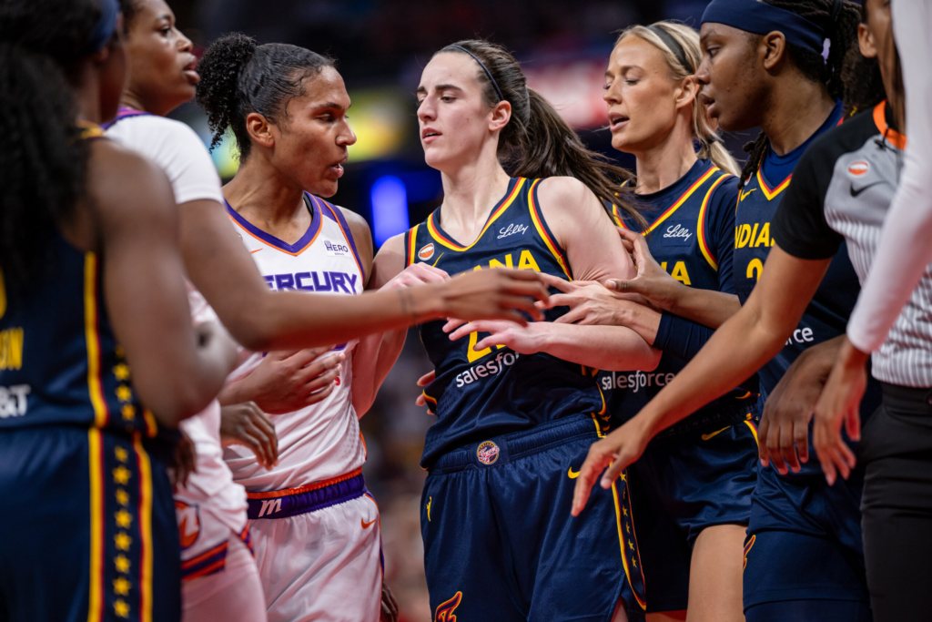 Alyssa Thomas #25 of the Phoenix Mercury and Caitlin Clark #22 of the Indiana Fever get into a scuffle during the game at Gainbridge Fieldhouse on June 22, 2026 in Indianapolis, Indiana.