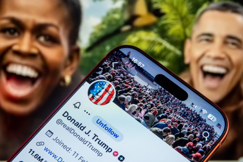 In this photo illustration a smartphone screen displays the Truth Social profile of U.S. President Donald Trump in front of still from a social media video which showed a racist clip depicting Barack and Michelle Obama as apes, that was posted and later deleted on his account, on February 7, 2026 in Bristol, England. (Photo by Matt Cardy/Getty Images)