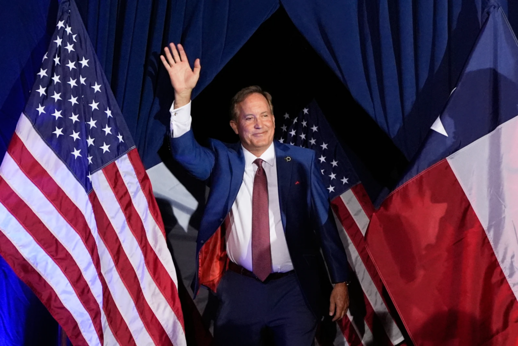 Texas Attorney General Ken Paxton, GOP candidate for the U.S. Senate, waves as he takes the stage during a primary runoff election night event after winning the GOP nomination, May 26, 2026, in Plano, Texas. (AP Photo/Tony Gutierrez, File)