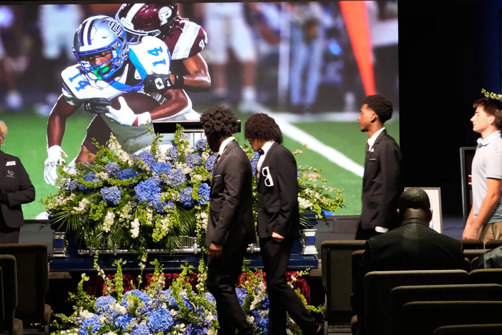 People line up for a viewing during a memorial service for Nolan Xavier Wells in Ocean Springs, Miss.
Gerald Herbert/AP