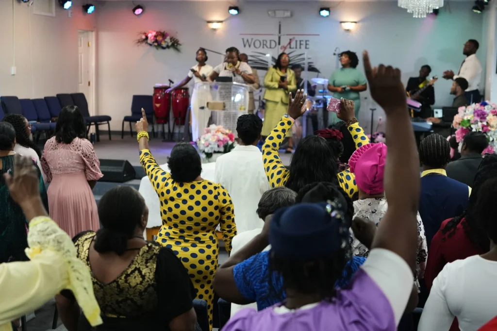 Members of the Word of Life Center, a church and hub of the Haitian community, sing and pray August 2 during a service in Salisbury, Maryland. Luis Andres Henao/AP