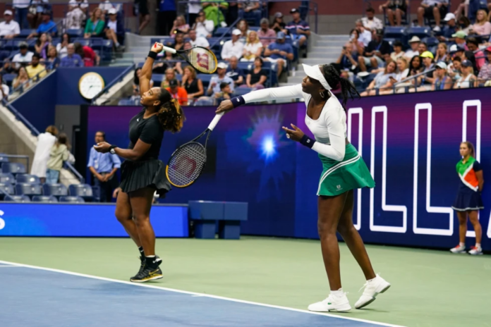 Serena Williams, left, and Venus Williams, of the United States, warm up before their first-round doubles match against Lucie Hradecká and Linda Nosková, of the Czech Republic, at the U.S. Open tennis championships, Sept. 1, 2022, in New York. (AP Photo/Charles Krupa, File)