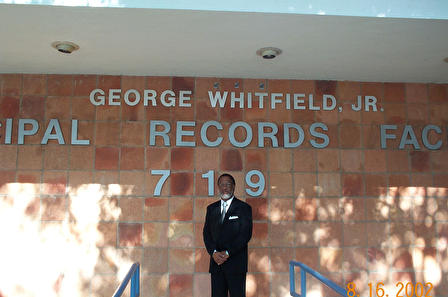 George Whitfield Jr. stands in front of the Municipal Records Facility in August 2002. Courtesy of Joesph Randle.