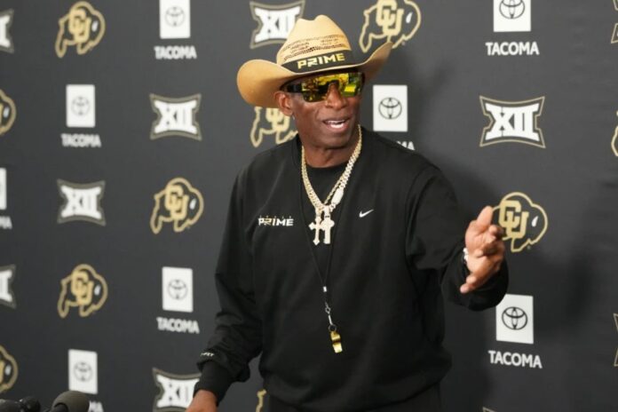 Colorado head coach Deion Sanders talks to reporters after practice at an NCAA college football training camp in Fountain, Colo., Thursday, Aug. 6, 2026. (AP Photo/David Zalubowski)