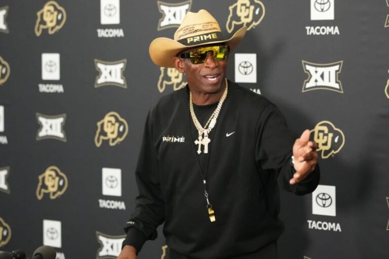 Colorado head coach Deion Sanders talks to reporters after practice at an NCAA college football training camp in Fountain, Colo., Thursday, Aug. 6, 2026. (AP Photo/David Zalubowski)