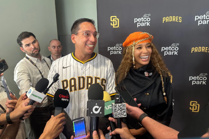 New San Diego Padres owners Kwanza Jones, right, and José E. Feliciano speak to the media at Petco Park in San Diego, Calif., Monday, Aug. 24, 2026. (AP Photo/Greg Beacham)