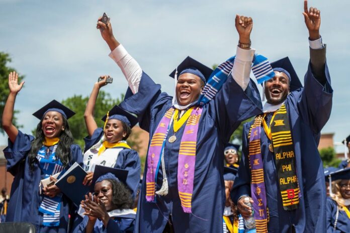 HBCU graduates celebrate during a commencement ceremony. A landmark new study found recent HBCU alumni outperform national benchmarks in well-being, workplace engagement and sense of belonging.