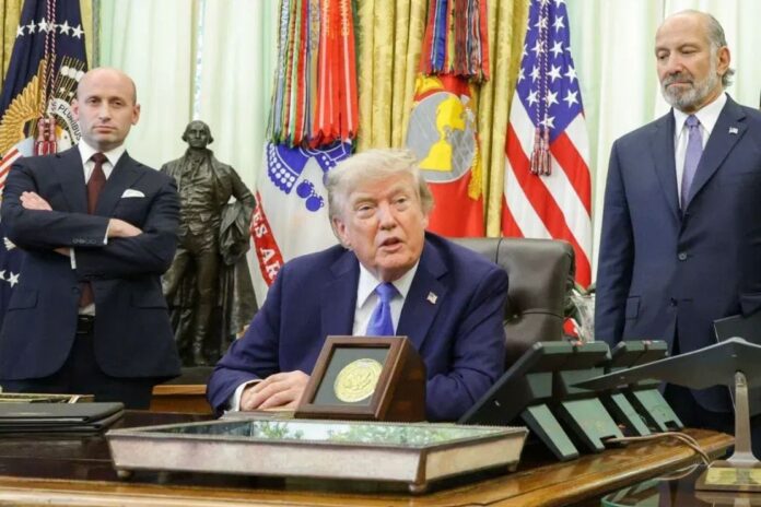 President Donald Trump speaks as White House Deputy Chief of Staff and Homeland Security Advisor Stephen Miller (L) and U.S. Commerce Secretary Howard Lutnick look on during an event in the Oval Office of the White House on Aug. 6, 2026, in Washington. (Photo by Alex Wong/Getty Images)